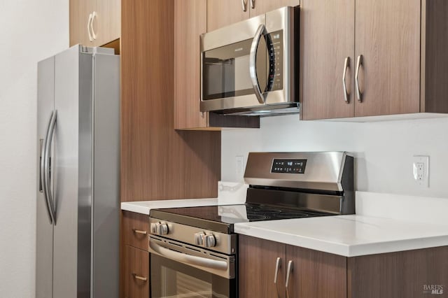 1201 Glen Cove Pkwy Unit 514, Vallejo, CA 94591 - kitchen with stainless steel appliances, light countertops, brown cabinets, and modern cabinets