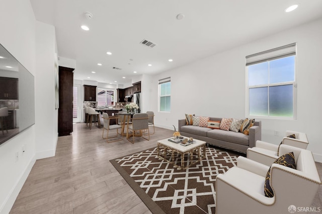 8534 Jetty Way, Newark, CA 94560 - living room with recessed lighting, light wood finished floors, and baseboards