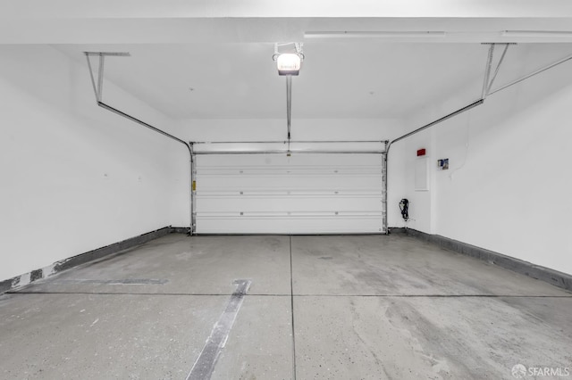 8534 Jetty Way, Newark, CA 94560 - garage featuring a garage door opener and baseboards