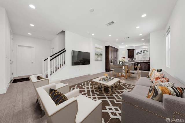 8534 Jetty Way, Newark, CA 94560 - living room featuring light wood-style floors, recessed lighting, stairs, and baseboards