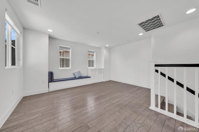 8534 Jetty Way, Newark, CA 94560 - empty room with wood finished floors, plenty of natural light, recessed lighting, and baseboards