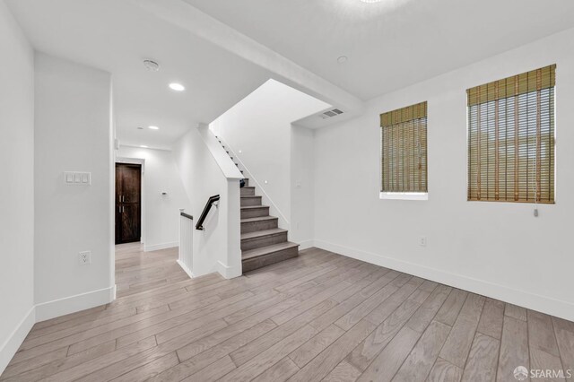 8534 Jetty Way, Newark, CA 94560 - empty room featuring wood finished floors, baseboards, stairway, and recessed lighting