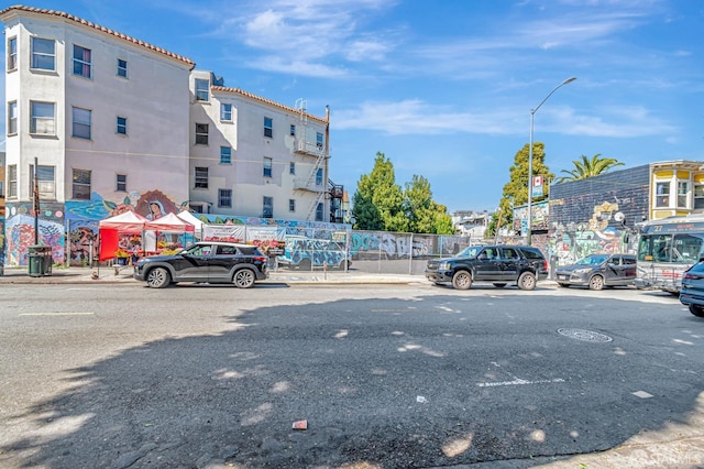 3230-3236 24th St, San Francisco, CA 94110 - view of asphalt street with street lighting, curbs, and sidewalks
