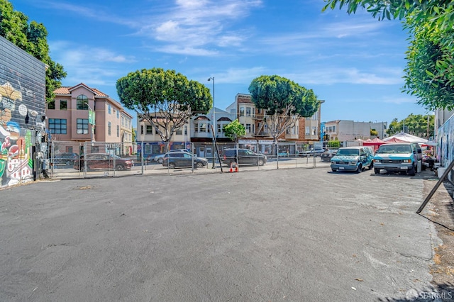 3230-3236 24th St, San Francisco, CA 94110 - view of asphalt road with a residential view and street lighting