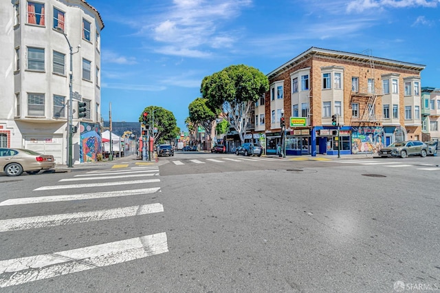 3230-3236 24th St, San Francisco, CA 94110 - view of asphalt road with street lighting, sidewalks, and curbs