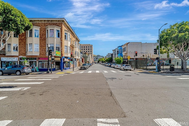 3230-3236 24th St, San Francisco, CA 94110 - view of asphalt street with street lighting, sidewalks, and curbs