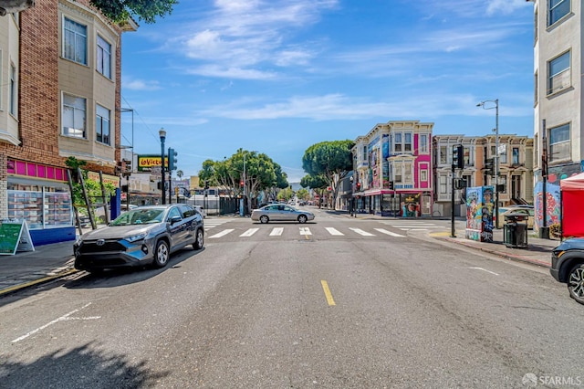 3230-3236 24th St, San Francisco, CA 94110 - view of asphalt road with street lighting, curbs, and sidewalks