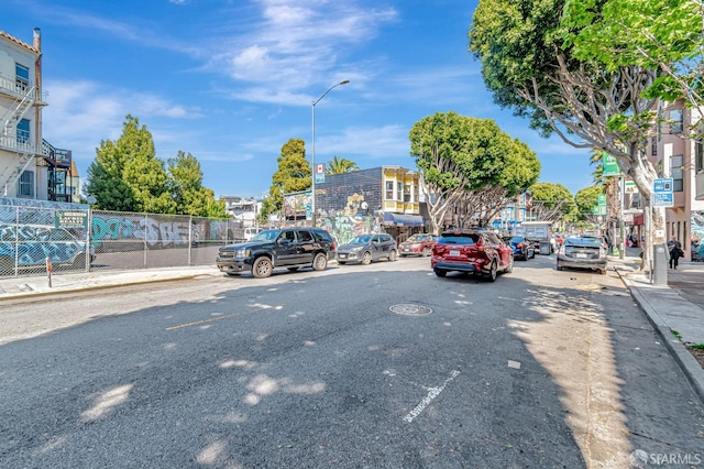 3230-3236 24th St, San Francisco, CA 94110 - view of asphalt road with street lighting, curbs, and sidewalks