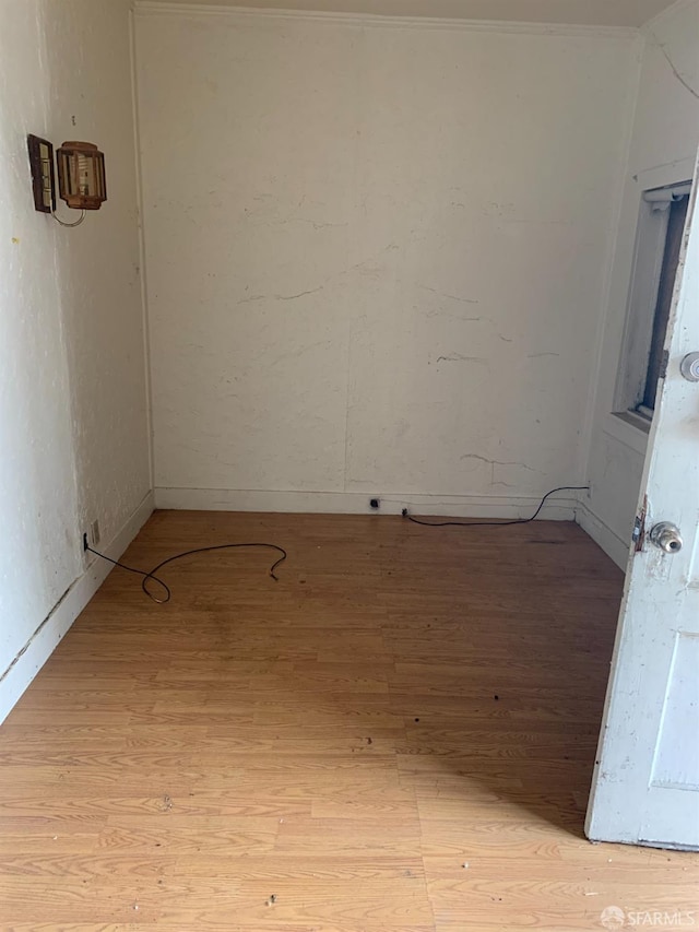 spare room with light wood-type flooring