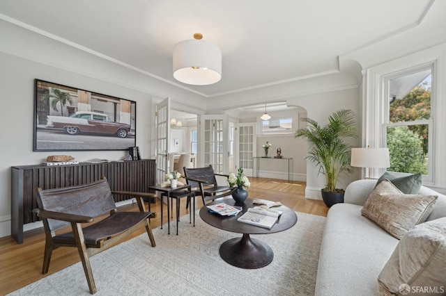 sunroom featuring arched walkways