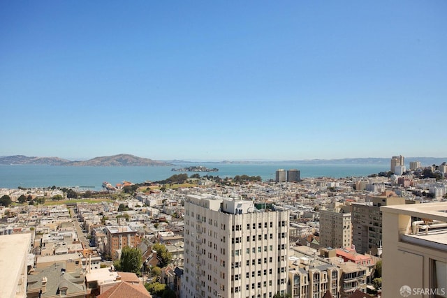 bird's eye view with a view of city and a water and mountain view