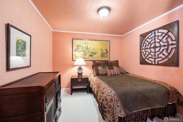 bedroom with carpet floors, crown molding, and baseboards