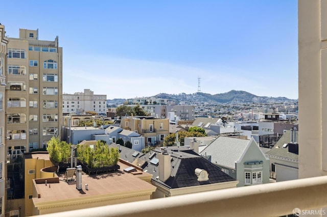 property's view of city featuring a mountain view