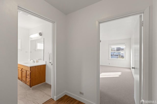 hallway featuring sink