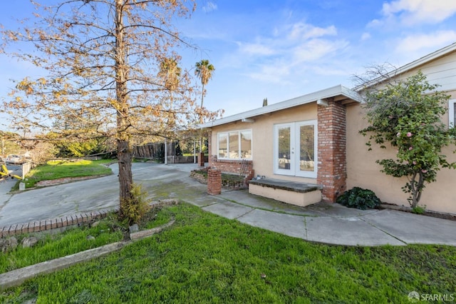 exterior space with french doors and a patio area