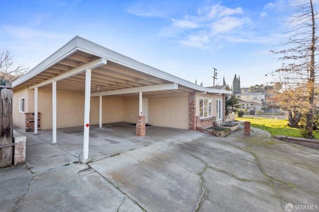 exterior space featuring a carport