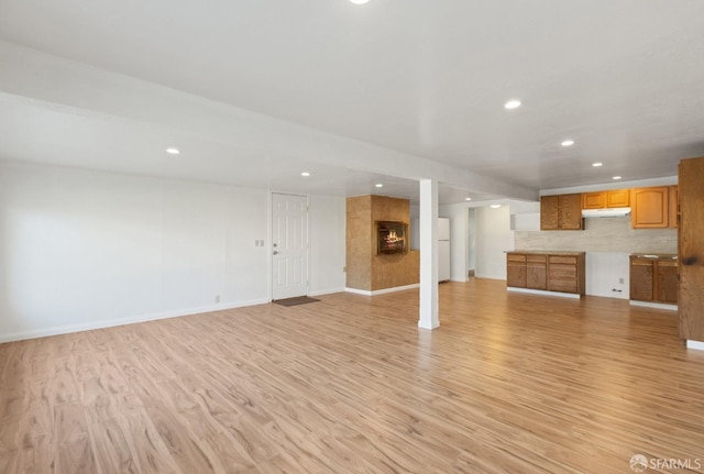 unfurnished living room featuring light wood-type flooring