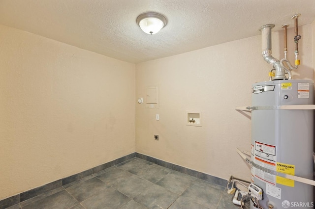 laundry area featuring hookup for a washing machine, hookup for an electric dryer, a textured ceiling, and strapped water heater