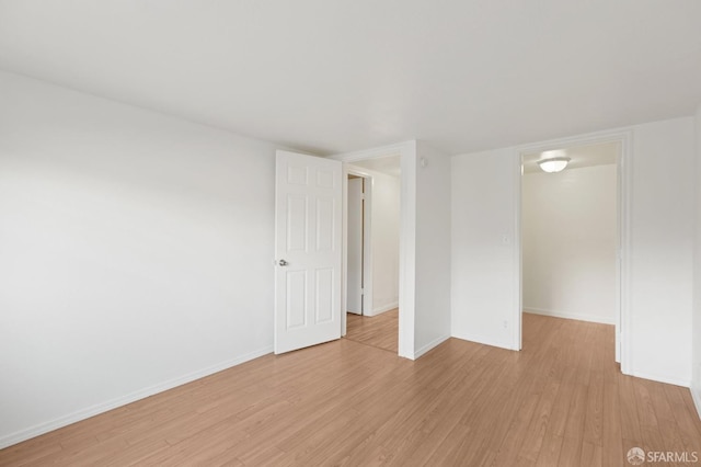 unfurnished room with light hardwood / wood-style flooring