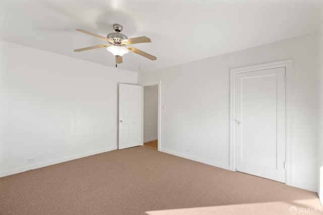 unfurnished room featuring carpet floors and ceiling fan