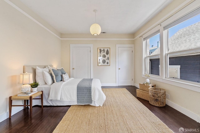 bedroom featuring dark wood-type flooring