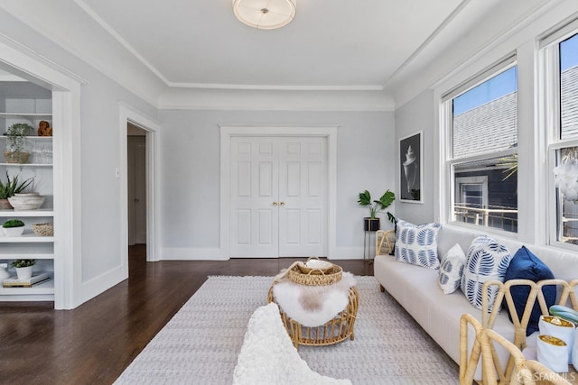 living room with dark hardwood / wood-style floors and built in features