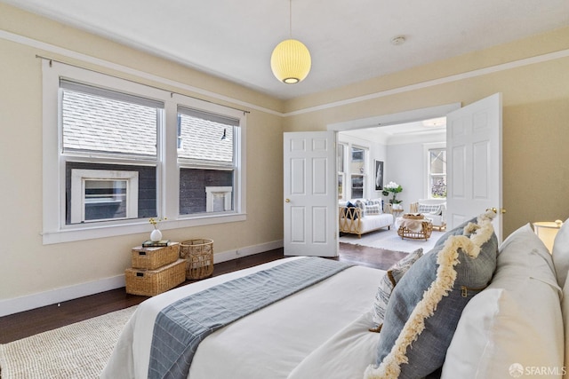 bedroom with dark wood-type flooring