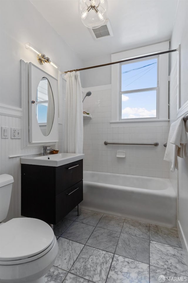 full bathroom with vanity, toilet, and shower / tub combo