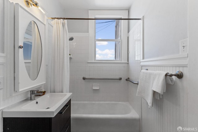 bathroom with shower / bath combination with curtain and vanity