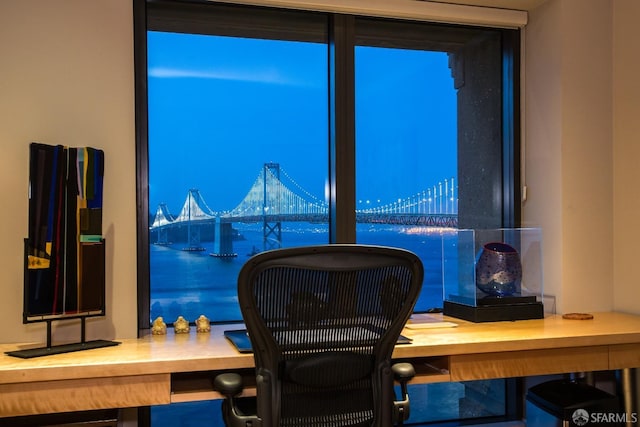 office space featuring a water view