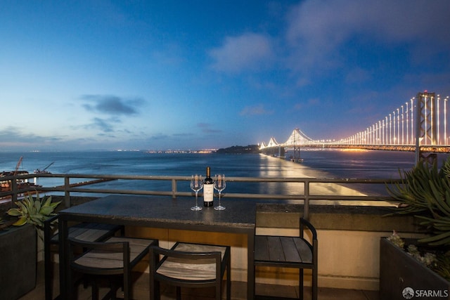 patio terrace at dusk with a water view