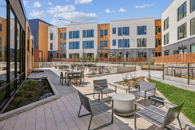 view of property's community featuring a patio area