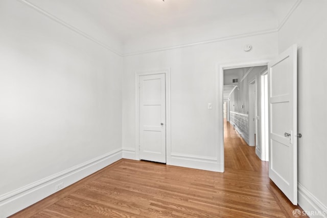 unfurnished bedroom with hardwood / wood-style floors