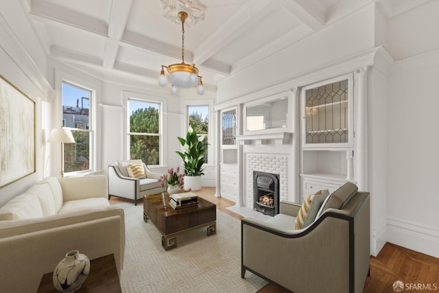 living room with coffered ceiling, parquet floors, beamed ceiling, and a brick fireplace