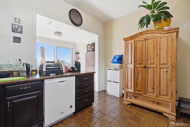 kitchen with dishwasher and dark tile patterned flooring