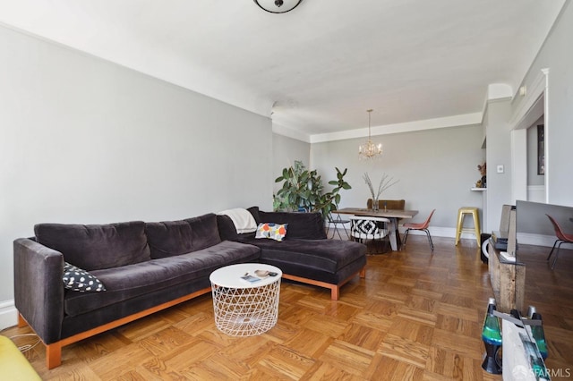 living room with a notable chandelier and parquet flooring