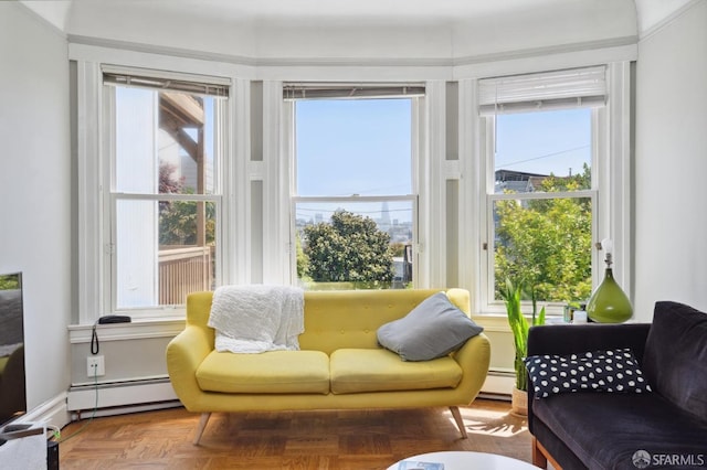 interior space with a baseboard radiator and plenty of natural light