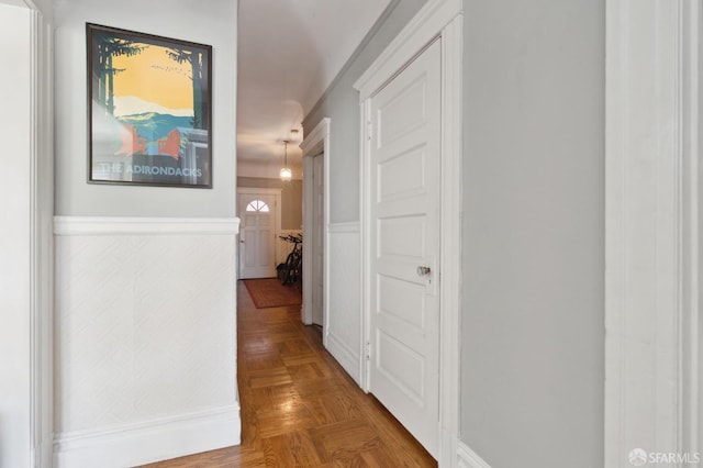 corridor with parquet flooring