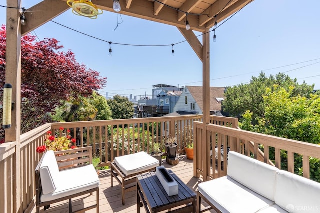 wooden terrace featuring an outdoor living space