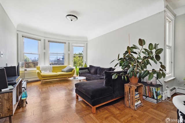 living room featuring parquet floors and a baseboard heating unit