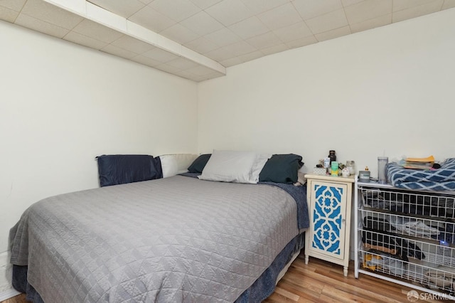 bedroom featuring hardwood / wood-style floors