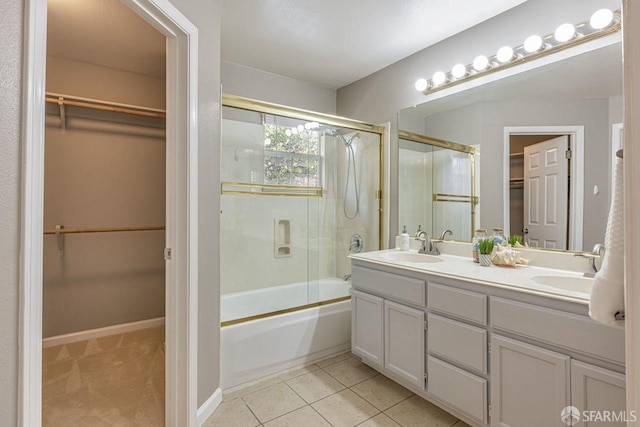 3587 Fitzsimmons Cmn, Fremont, CA 94538 - bathroom with bath / shower combo with glass door, double vanity, a walk in closet, and tile patterned floors