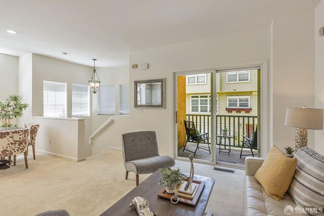 3587 Fitzsimmons Cmn, Fremont, CA 94538 - living room featuring carpet and a chandelier