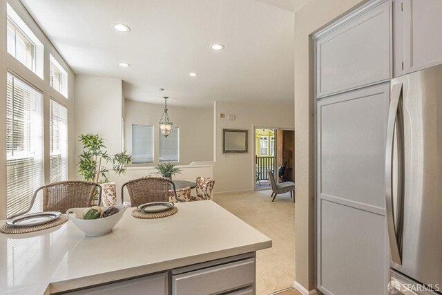 3587 Fitzsimmons Cmn, Fremont, CA 94538 - kitchen featuring freestanding refrigerator, recessed lighting, light carpet, light countertops, and decorative light fixtures