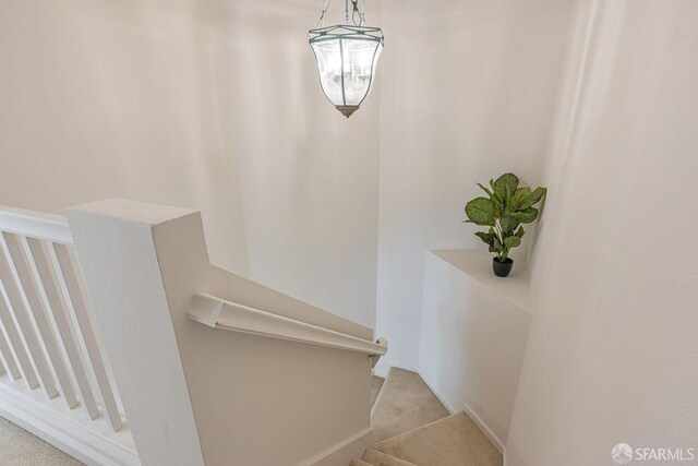 3587 Fitzsimmons Cmn, Fremont, CA 94538 - staircase featuring carpet floors