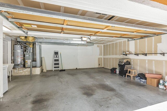 3587 Fitzsimmons Cmn, Fremont, CA 94538 - garage with water heater, heating unit, and a garage door opener