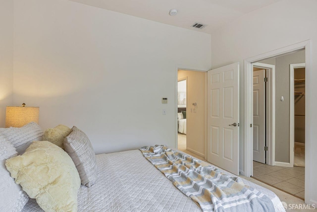 3587 Fitzsimmons Cmn, Fremont, CA 94538 - bedroom with light tile patterned floors and a spacious closet