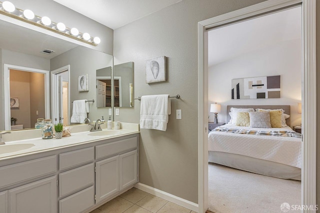 3587 Fitzsimmons Cmn, Fremont, CA 94538 - bathroom with ensuite bath, double vanity, and tile patterned floors