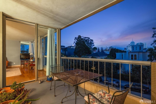 view of balcony at dusk