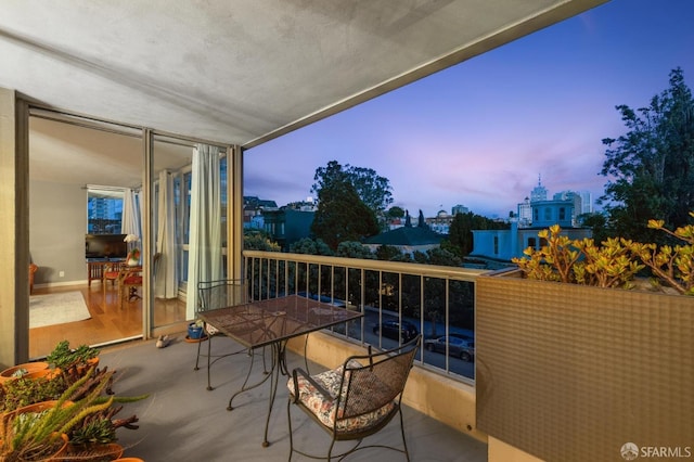 view of balcony at dusk